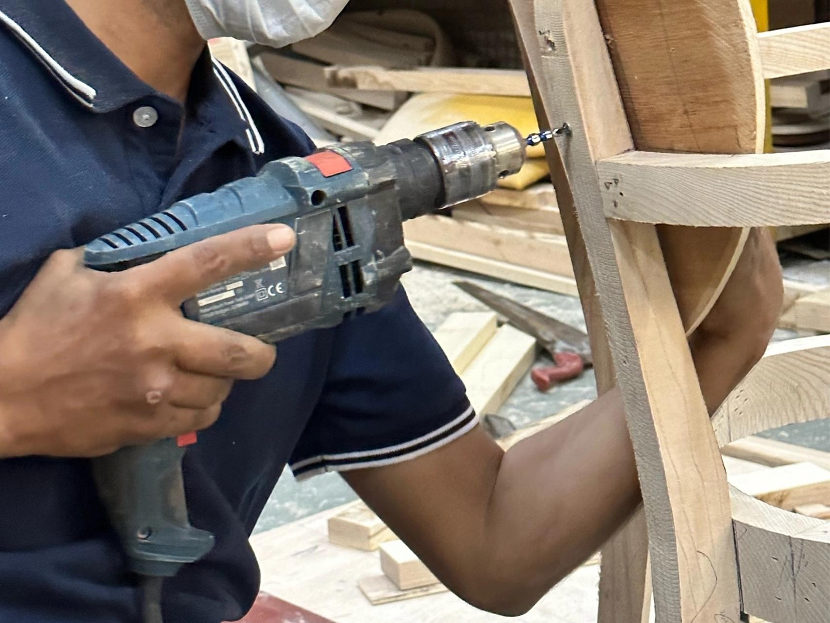 A man is shaping wood